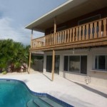 View of back of house and upper deck