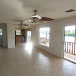 Living room to kitchen with outdoor views