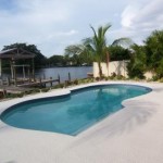 Large pool overlooking the water and dock