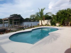 Large pool overlooking the water and dock